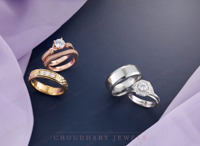 Two bridal sets on navy and lavender fabric: a rose gold engagement ring with a diamond band, and a white gold hexagon halo ring with a white metal band.